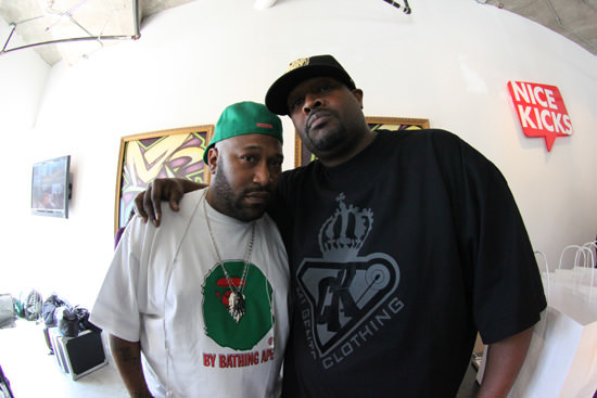 DJ Clark Kent & Bun B pose in the shop