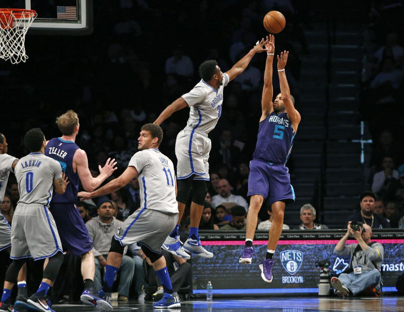 Thaddeus Young contesting a shot in a Nike Kyrie 2 iD