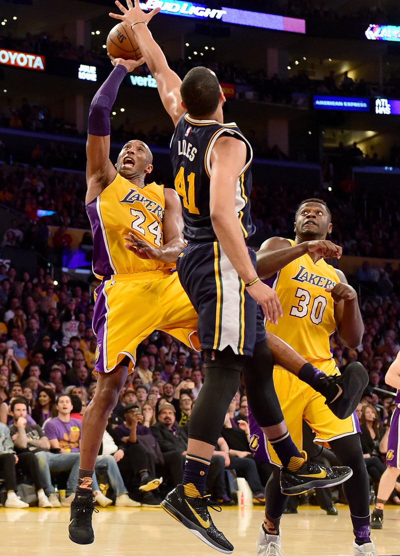 LOS ANGELES, CA - APRIL 13:  Kobe Bryant #24 of the Los Angeles Lakers goes up for a shot against Trey Lyles #41 of the Utah Jazz in the third quarter at Staples Center on April 13, 2016 in Los Angeles, California. NOTE TO USER: User expressly acknowledges and agrees that, by downloading and or using this photograph, User is consenting to the terms and conditions of the Getty Images License Agreement.  (Photo by Harry How/Getty Images)