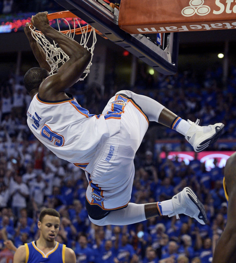 May 22, 2016; Oklahoma City, OK, USA; Oklahoma City Thunder forward Serge Ibaka (9) dunks the ball during the first quarter against the Golden State Warriors in game three of the Western conference finals of the NBA Playoffs at Chesapeake Energy Arena. Mandatory Credit: Mark D. Smith-USA TODAY Sports