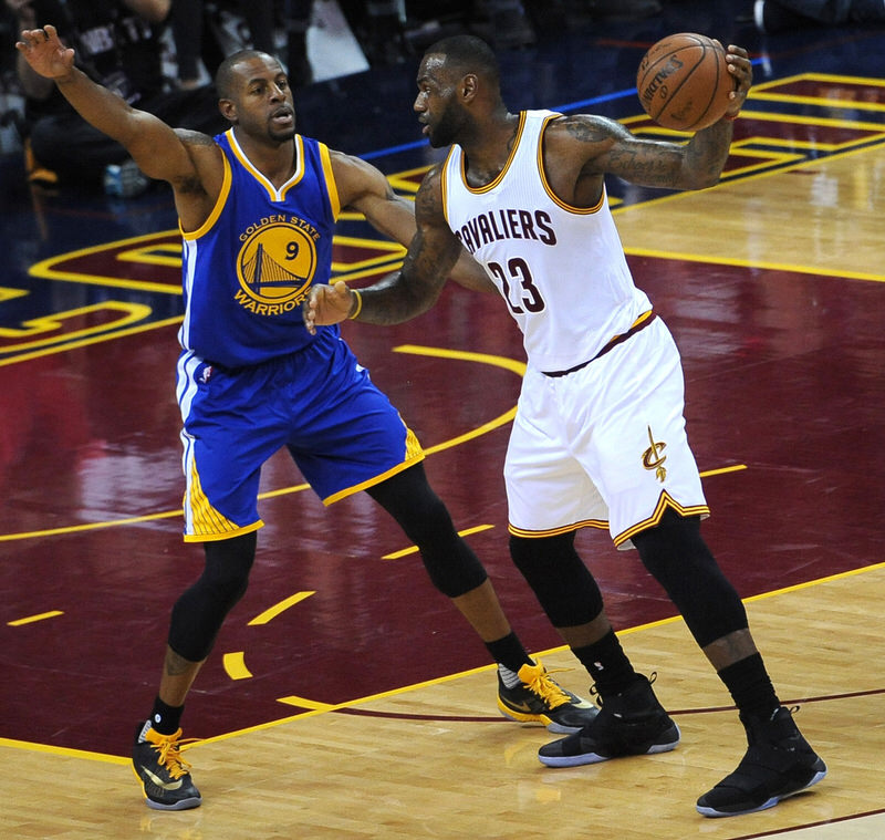 CLEVELAND, OH - JUNE 8: LeBron James #23 of the Cleveland Cavaliers handles the ball against Andre Iguodala #9 of the Golden State Warriors in Game Three of the 2016 NBA Finals on June 8, 2016 at Quicken Loans Arena in Cleveland, Ohio. NOTE TO USER: User expressly acknowledges and agrees that, by downloading and/or using this Photograph, user is consenting to the terms and conditions of the Getty Images License Agreement. Mandatory Copyright Notice: Copyright 2016 NBAE (Photo by Noah Graham/NBAE via Getty Images)