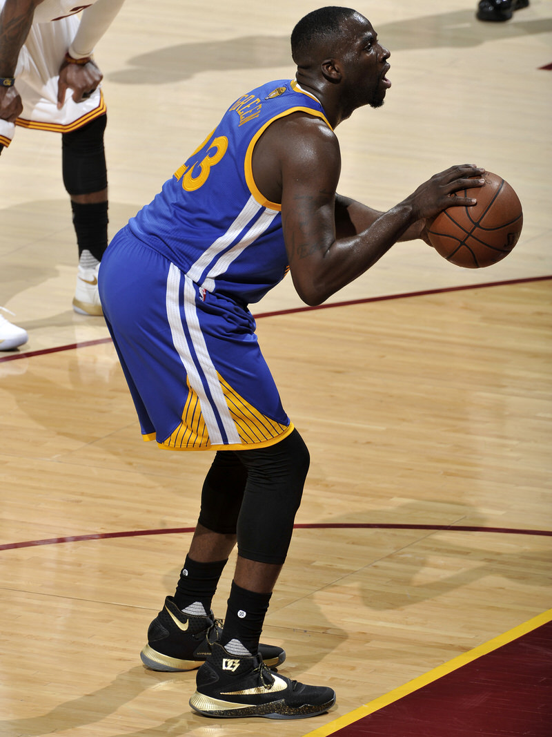 CLEVELAND, OH - JUNE 8: Draymond Green #23 of the Golden State Warriors prepares to shoot a free throw against the Cleveland Cavaliers in Game Three of the 2016 NBA Finals on June 8, 2016 at The Quicken Loans Arena in Cleveland, Ohio. NOTE TO USER: User expressly acknowledges and agrees that, by downloading and or using this photograph, user is consenting to the terms and conditions of Getty Images License Agreement. Mandatory Copyright Notice: Copyright 2016 NBAE (Photo by David Liam Kyle/NBAE via Getty Images)