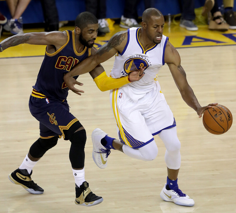 OAKLAND, CA - JUNE 02:  Andre Iguodala #9 of the Golden State Warriors with the ball against Kyrie Irving #2 of the Cleveland Cavaliers in the second half in Game 1 of the 2016 NBA Finals at ORACLE Arena on June 2, 2016 in Oakland, California. NOTE TO USER: User expressly acknowledges and agrees that, by downloading and or using this photograph, User is consenting to the terms and conditions of the Getty Images License Agreement.  (Photo by Ronald Martinez/Getty Images)