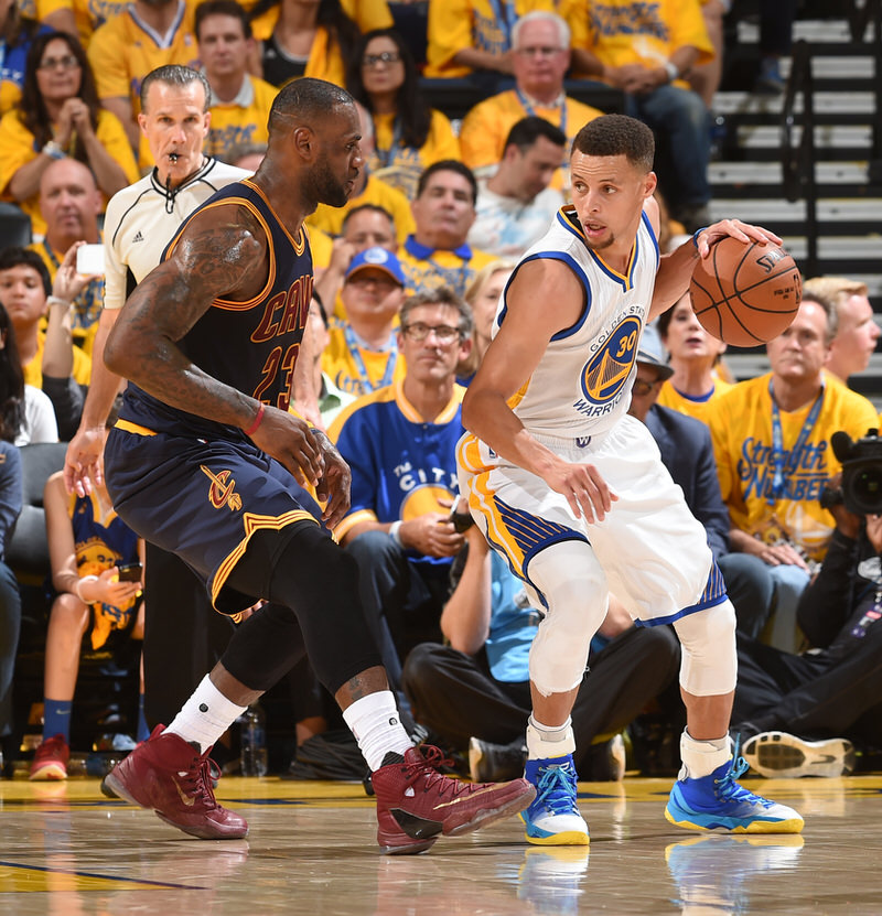 OAKLAND, CA - JUNE 2:  Stephen Curry #30 of the Golden State Warriors handles the ball against LeBron James #23 of the Cleveland Cavaliers in Game One of the 2016 NBA Finals on June 2, 2016 at Oracle Arena in Oakland, California. NOTE TO USER: User expressly acknowledges and agrees that, by downloading and or using this photograph, user is consenting to the terms and conditions of Getty Images License Agreement. Mandatory Copyright Notice: Copyright 2016 NBAE (Photo by Andrew D. Bernstein/NBAE via Getty Images)