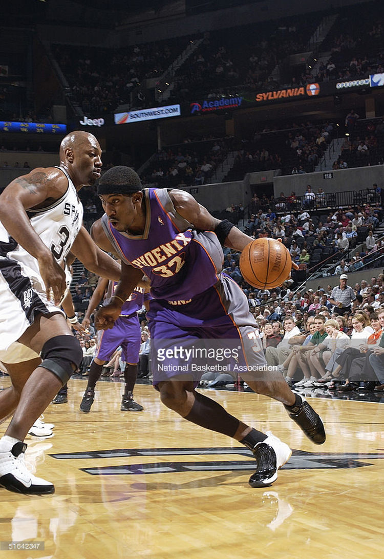 SAN ANTONIO - OCTOBER 19: Amare Stoudemire #32 of the Phoenix Suns drives against Tony Massenburg #34 of the San Antonio Spurs during a preseason game on October 19, 2004 at SBC Center in San Antonio, Texas. The Suns won 104-96. NOTE TO USER: User expressly acknowledges and agrees that, by downloading and/or using this Photograph, user is consenting to the terms and conditions of the Getty Images License Agreement. Mandatory Copyright Notice: Copyright 2004 NBAE (Photo by D.Clarke Evans/NBAE via Getty Images.) *** Local Caption *** Amare Stoudemire;Tony Massenburg