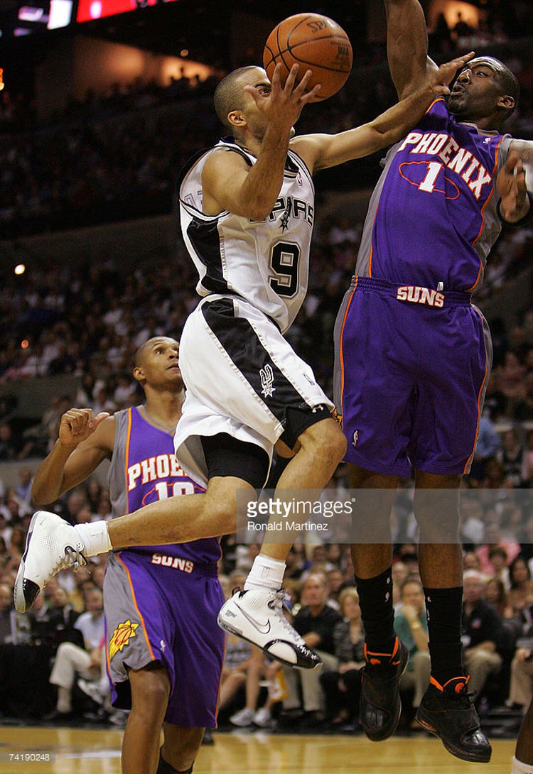 SAN ANTONIO - MAY 18: Guard Tony Parker #9 of the San Antonio Spurs takes a shot against Amare Stoudemire #1 of the Phoenix Suns in Game Six of the Western Conference Semifinals during the 2007 NBA Playoffs at AT&T Center on May 18, 2007 in San Antonio, Texas. NOTE TO USER: User expressly acknowledges and agrees that, by downloading and or using this photograph, User is consenting to the terms and conditions of the Getty Images License Agreement. (Photo by Ronald Martinez/Getty Images) *** Local Caption *** Tony Parker;Amare Stoudemire