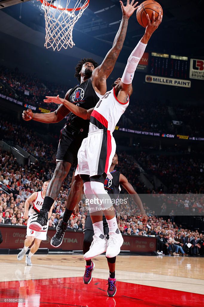 PORTLAND, OR - OCTOBER 27: Damian Lillard #0 of the Portland Trail Blazers shoots the ball against DeAndre Jordan #6 of the LA Clippers on October 27, 2016 at the Moda Center in Portland, Oregon. NOTE TO USER: User expressly acknowledges and agrees that, by downloading and or using this Photograph, user is consenting to the terms and conditions of the Getty Images License Agreement. Mandatory Copyright Notice: Copyright 2016 NBAE (Photo by Sam Forencich/NBAE via Getty Images)