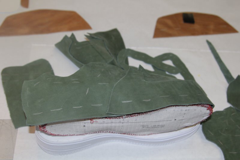 Laying out the leather pieces of an Air Force 1