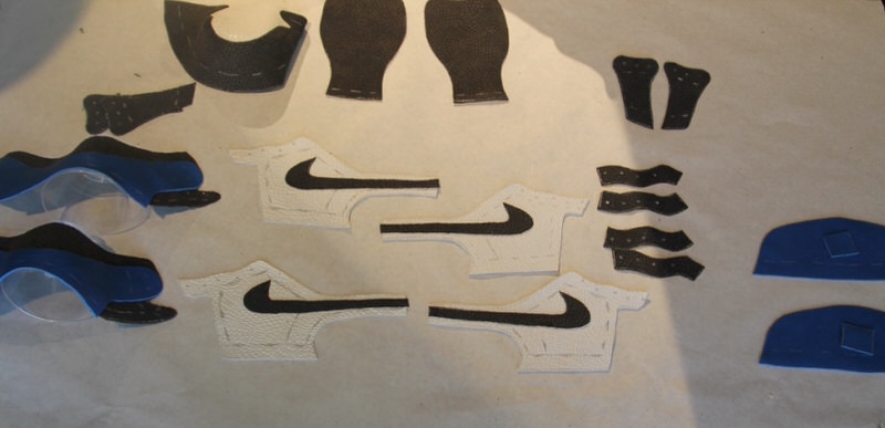 Laying out the pattern of the Air Jordan 1 and allowing the adhesive to dry