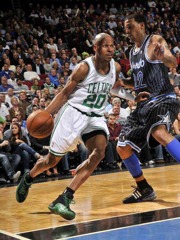 ORLANDO, FL - JANUARY 28: Ray Allen #20 of the Boston Celtics moves the ball against Matt Barnes #22 of the Orlando Magic during the game on January 28, 2010 at Amway Arena in Orlando, Florida. NOTE TO USER: User expressly acknowledges and agrees that, by downloading and or using this photograph, User is consenting to the terms and conditions of the Getty Images License Agreement. Mandatory Copyright Notice: Copyright 2010 NBAE (Photo by Fernando Medina/NBAE via Getty Images)