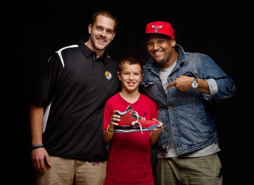 Cole Johanson, age 11, with his Nike design team, Jake Van Damm, left, Jason Mayden, right, and Cole’s Air Jordan III for the Doernbecher Freestyle Collection.