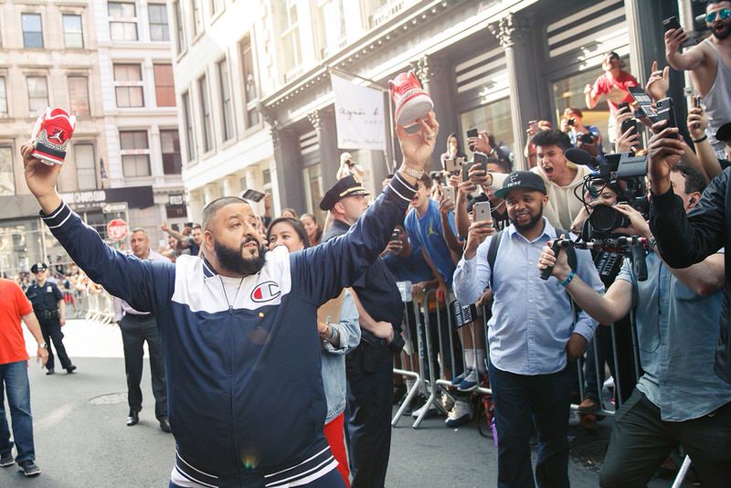 DJ Khaled holds his Air Jordan 3 collaboration at event outside of Stadium Goods