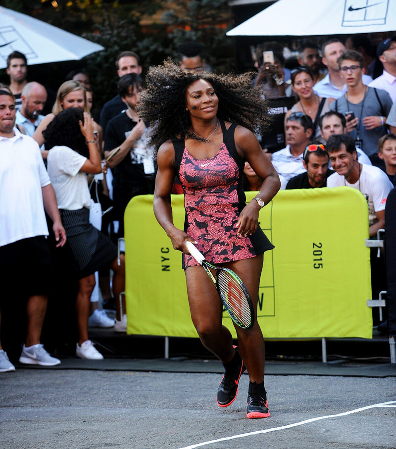 Packing heat while playing tennis in the streets.