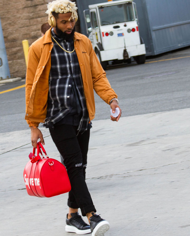 OBJ exaggerates the low-profile look by pairing it with a series of neutrals and Alexander McQueen Exaggerated Sole Sneakers.