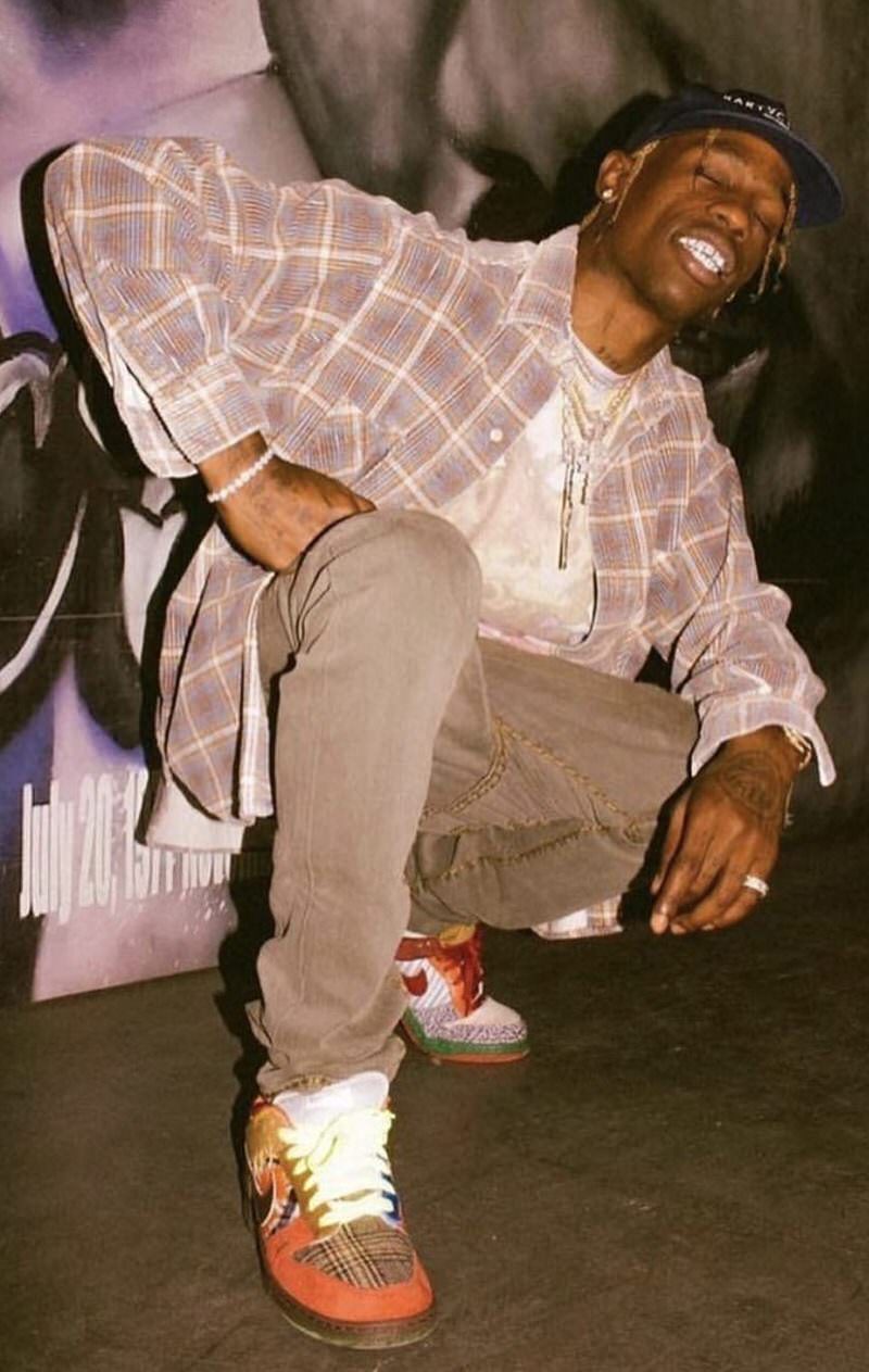 Travis Scott wearing the majority of his most grailed Dunks in one pair.