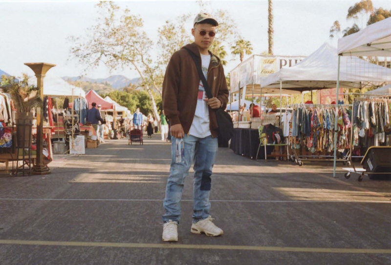 @franchofs pairs patchwork denim with neutral tones and a throwback graphic tee.