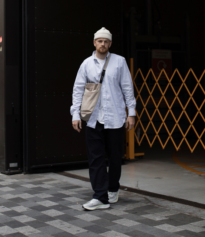 @olvh pairs wide-legged trousers and an unbutton shirt with a tee layered underneath with his Zoom Fly SPs.