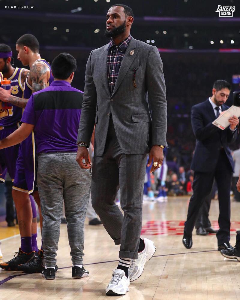 LeBron James wears the A-COLD-WALL x Nike Zoom Vomero 5s with a Thom Browne suit.