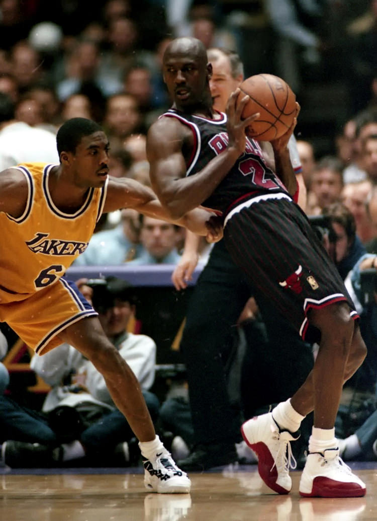 Michael Jordan wearing the Air Jordan 12 White/Varsity Red