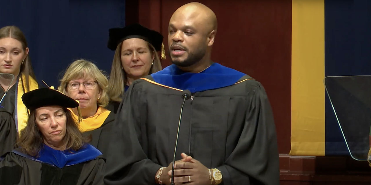 KeJuan Wilkins delivering commencement speech at University of Michigan